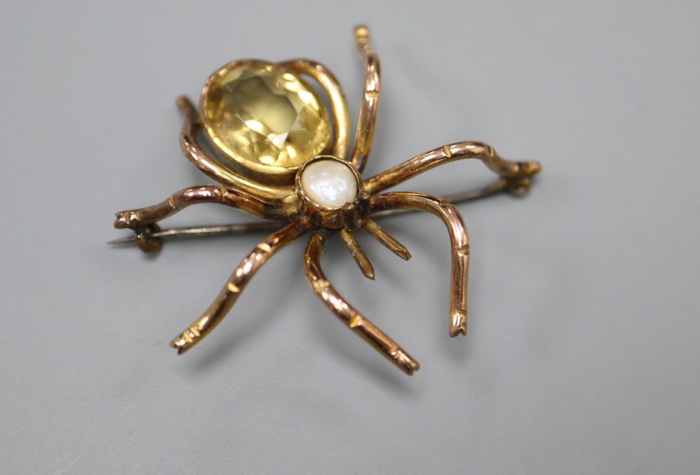 A yellow metal, citrine and split pearl set spider brooch, 36mm, gross 8.4 grams.